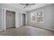 Bedroom with ceiling fan, wood-look floors and double closets at 316 Field St, Graham, NC 27253