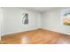 Bright bedroom with hardwood floors and large windows at 3521 Carolyn Dr, Raleigh, NC 27604