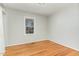 Spacious bedroom with hardwood floors and a window at 3521 Carolyn Dr, Raleigh, NC 27604