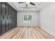 Spacious bedroom featuring a dark accent wall and hardwood floors at 4017 Mebane Oaks Rd, Mebane, NC 27302