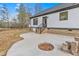 Concrete patio with fire pit area and steps leading to the house at 4017 Mebane Oaks Rd, Mebane, NC 27302