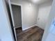 Bright entryway with wood-look floors and coat closet at 4553 Dedication Dr, Raleigh, NC 27610