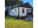 Side view of a charming house with a well-manicured lawn at 4553 Dedication Dr, Raleigh, NC 27610