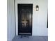 Modern black front door with a welcoming doormat at 4553 Dedication Dr, Raleigh, NC 27610