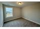 Spacious bedroom featuring carpeted floors and a window at 523 Eversden Dr, Zebulon, NC 27597