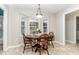 Bright breakfast nook features a built-in window seat and wood table at 62 Clarence Ln, Garner, NC 27529