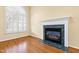 Fireplace with a green marble surround and white mantel at 8300 Hempshire Place # 104, Raleigh, NC 27613