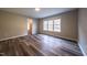 Spacious bedroom with hardwood floors and access to bathroom at 919 Blue Garden Ln, Willow Springs, NC 27592