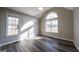 Bright office features hardwood floors, large windows, and vaulted ceiling at 919 Blue Garden Ln, Willow Springs, NC 27592