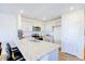 Modern kitchen with white cabinets, granite countertops, and stainless steel appliances at 301 Cherry Laurel Dr, Sanford, NC 27332