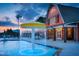 Resort-style pool with a mushroom fountain and nearby clubhouse at 38 Windchime Ct, Fuquay Varina, NC 27526