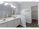 Clean bathroom with double vanity, shower, and access to a walk-in closet at 524 Glenolden Ct, Cary, NC 27513