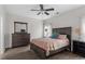Bright bedroom with a comfortable bed and plenty of dresser storage at 524 Glenolden Ct, Cary, NC 27513