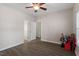 Bright bedroom with ceiling fan, and access to bathroom and hallway at 524 Glenolden Ct, Cary, NC 27513
