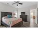 Spacious bedroom with a large bed, dresser, and access to another room at 524 Glenolden Ct, Cary, NC 27513