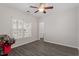 Spacious bedroom with a ceiling fan and large window at 524 Glenolden Ct, Cary, NC 27513