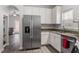 Kitchen with stainless steel refrigerator and white cabinets at 524 Glenolden Ct, Cary, NC 27513