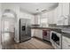 Modern kitchen featuring stainless steel appliances and granite countertops at 524 Glenolden Ct, Cary, NC 27513
