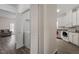 Laundry closet with washer and dryer, and a view of living area and kitchen at 524 Glenolden Ct, Cary, NC 27513