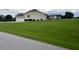 House exterior showcasing a large, ranch style home with a spacious lawn at 6101 Valentine St, Zebulon, NC 27597