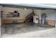 Attached garage with ample storage shelving and stairs at 6101 Valentine St, Zebulon, NC 27597