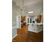 Kitchen with stainless steel appliances, hardwood floors, and breakfast bar at 6101 Valentine St, Zebulon, NC 27597