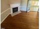 Living room with hardwood floors, fireplace and access to sunroom at 6101 Valentine St, Zebulon, NC 27597