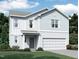 Two-story home with gray siding, two-car garage, and landscaped lawn at 7374 Pilatus Ave, Spring Hope, NC 27882