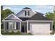 Two-story house with gray siding, white trim, and a two-car garage at 7552 Percussion Dr, Apex, NC 27539