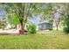 Houses with grassy backyard, trees, and patio at 810 Brooklyn St, Raleigh, NC 27605