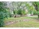Large backyard with grassy area and wooden fence at 810 Brooklyn St, Raleigh, NC 27605