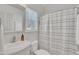 Clean bathroom with white vanity, shower/tub combo, and neutral color scheme at 810 Brooklyn St, Raleigh, NC 27605