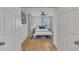 Bright bedroom with a queen bed and hardwood floors at 810 Brooklyn St, Raleigh, NC 27605