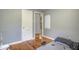Small bedroom with hardwood floors and gray walls at 810 Brooklyn St, Raleigh, NC 27605