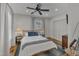 Bedroom with queen bed, hardwood floors, and ceiling fan at 810 Brooklyn St, Raleigh, NC 27605