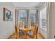 Charming built-in dining area with hardwood floors and a round wooden table with four chairs at 810 Brooklyn St, Raleigh, NC 27605