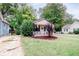 Quaint one-story home features a covered porch and well-maintained lawn at 810 Brooklyn St, Raleigh, NC 27605
