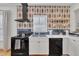 Modern kitchen with white cabinets, black appliances, and patterned backsplash at 810 Brooklyn St, Raleigh, NC 27605