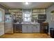 Full kitchen with updated appliances and open shelving at 810 Brooklyn St, Raleigh, NC 27605