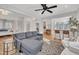 Open concept living room with gray sectional sofa and views into kitchen and bedroom at 810 Brooklyn St, Raleigh, NC 27605