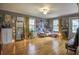 Spacious living area with hardwood floors, eclectic decor and large windows at 810 Brooklyn St, Raleigh, NC 27605