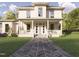 Two-story house with front porch, herringbone driveway, and landscaped lawn at 1245 Golfers Vw, Pittsboro, NC 27312