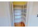 Empty pantry with wood floors and white shelves at 176 Whitt Town Rd, Roxboro, NC 27574