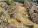 House located in a golf course community, near pond and road at 191 Pine Lake Dr, Siler City, NC 27344