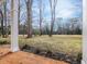 Landscaped backyard with a view of a golf course at 191 Pine Lake Dr, Siler City, NC 27344