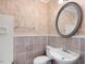 Clean bathroom with tile, a pedestal sink, and a shower at 191 Pine Lake Dr, Siler City, NC 27344