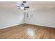 Bright bedroom featuring hardwood floors and ceiling fan at 191 Pine Lake Dr, Siler City, NC 27344