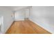 Bright bedroom with hardwood floors and access to another room at 191 Pine Lake Dr, Siler City, NC 27344