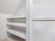 Spacious closet with built-in shelves and hanging rod at 191 Pine Lake Dr, Siler City, NC 27344