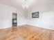 Bright dining room features hardwood floors, chandelier, and view into kitchen at 191 Pine Lake Dr, Siler City, NC 27344